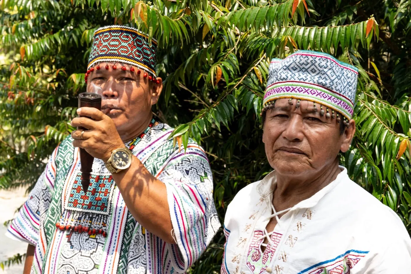 Maestro Miguel Muñoz with his son, both in Shipibo dress